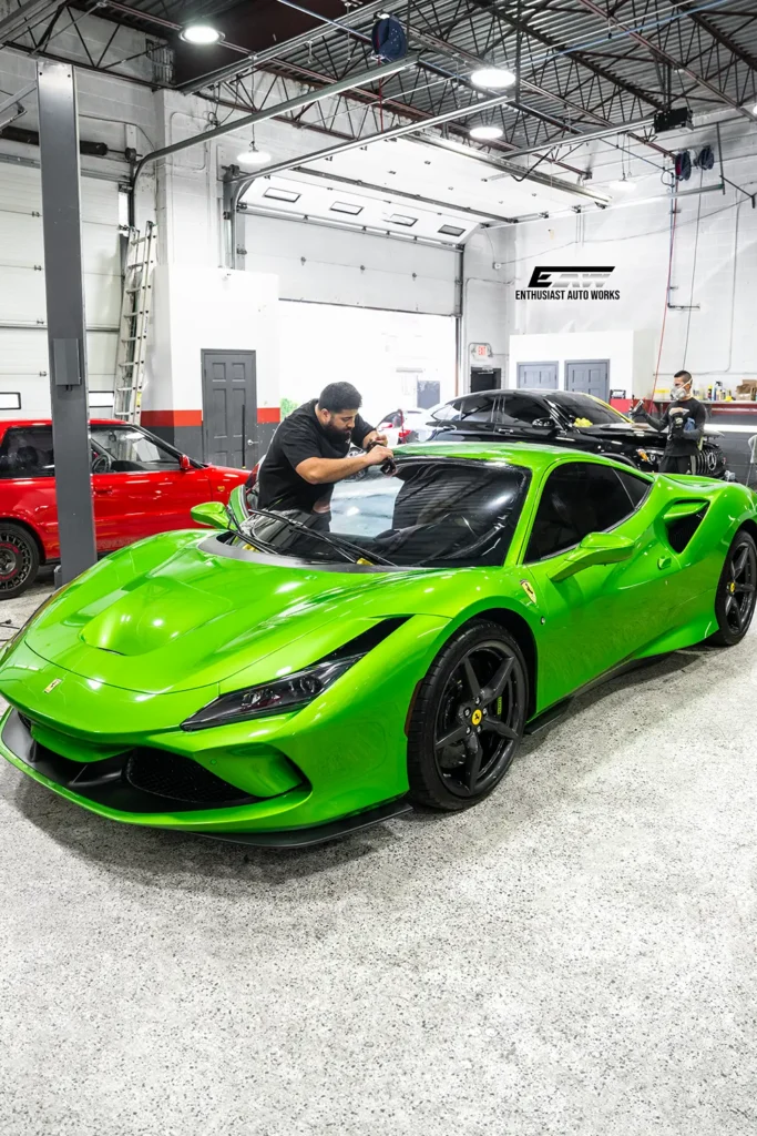 Technicians working on a Ferrari at Enthusiast Auto Works in New Rochelle NY